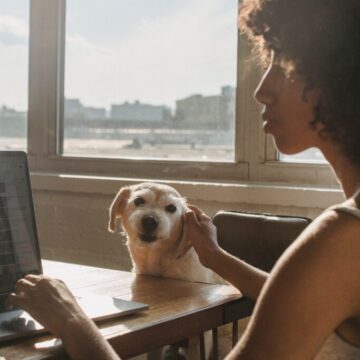 Lady with dog while working